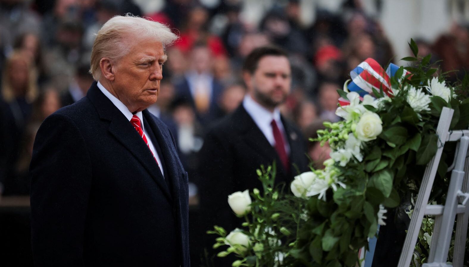 Trump and Vance attend a wreath-laying ceremony at Arlington National Cemetery on Sunday. Carlos Barria/Reuters