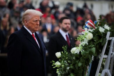 Trump and Vance attend a wreath-laying ceremony at Arlington National Cemetery on Sunday. Carlos Barria/Reuters