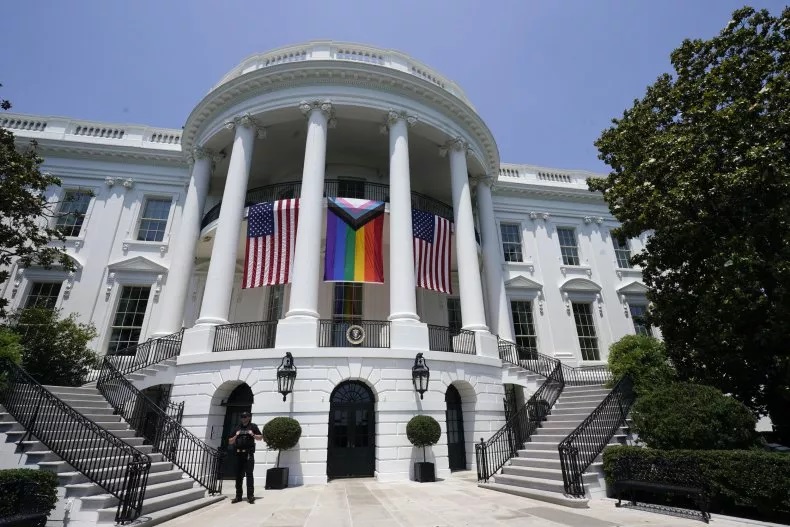 American flags and a pride flag hang from the White House during a Pride Month celebration on the South Lawn, Saturday, June 10, 2023, in Washington. AP Photo/Manuel Balce Ceneta