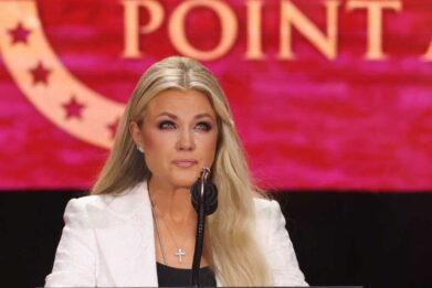 Erika Kirk, Charlie Kirk's widow, speaks at the public memorial service for right-wing activist Charlie Kirk at State Farm Stadium in Glendale, Arizona, on September 21, 2025. (Photo by Patrick T. Fallon / AFP) (Photo by PATRICK T. FALLON/AFP via Getty Images)